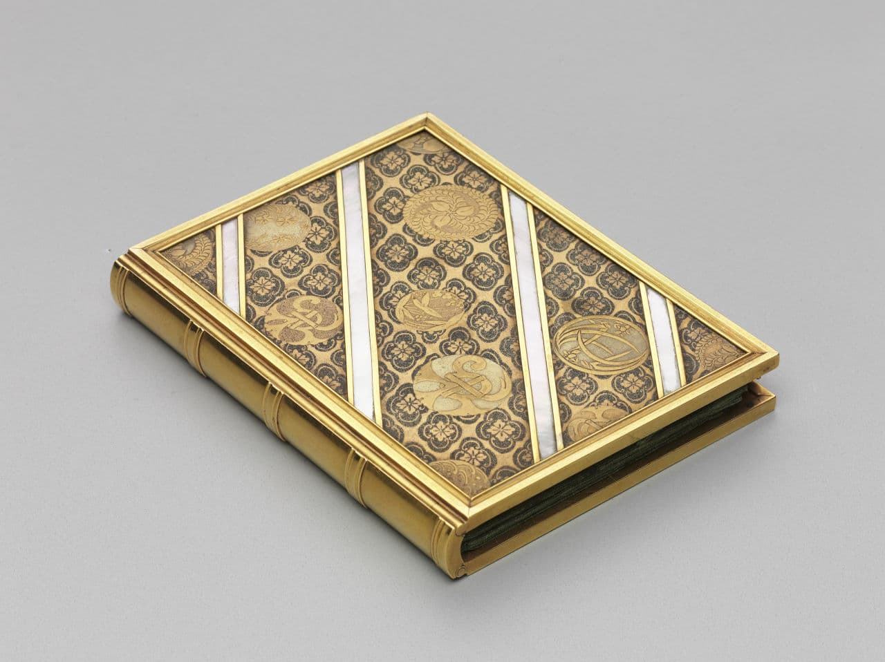 Souvenir notebook with pen. 19th century. Gold, lacquer, mother of pearl. Gift of the heirs of Bettina Looram de Rothschild. (Courtesy Museum of Fine Arts, Boston)