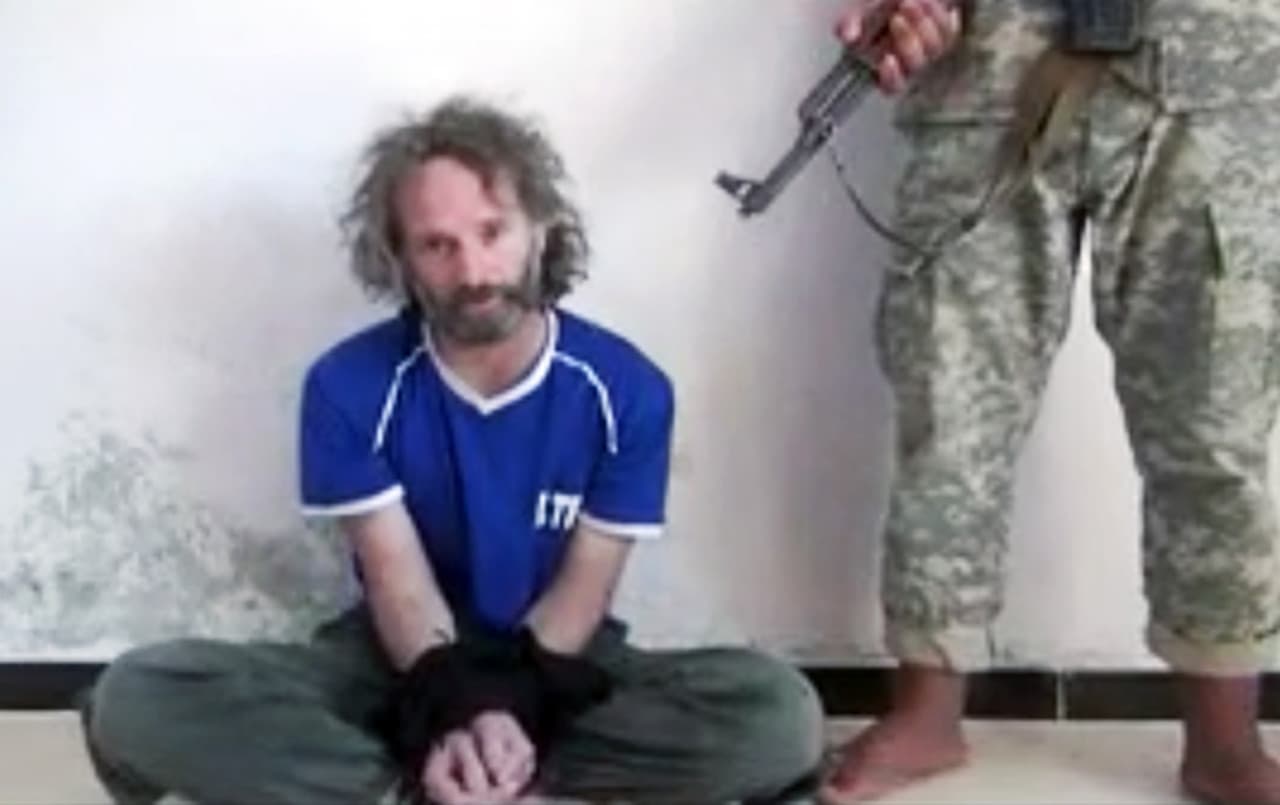In this image made from an undated video a man believed to be Peter Theo Curtis, a U.S. citizen held hostage by an al-Qaida linked group in Syria, delivers a statement. (AP)