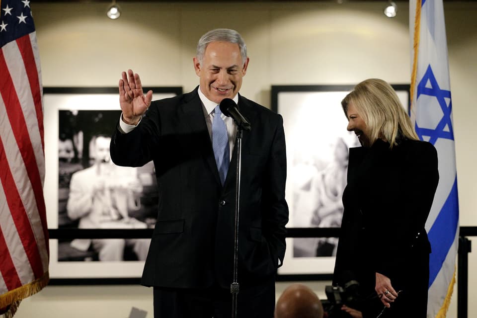 In this Tuesday, March 4, 2014 file photo, Israeli Prime Minister Benjamin Netanyahu, accompanied by his wife Sara, right, speaks before the screening of the television documentary "Israel: The Royal Tour" at Paramount Studios in Los Angeles. (AP)