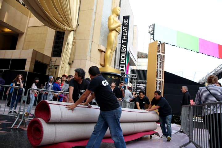 Workers move red carpet as preparations are made for the 87th Academy Awards in Los Angeles, Wednesday, Feb. 18, 2015. The Academy Awards will be held at the Dolby Theatre on Sunday, Feb. 22. (AP)