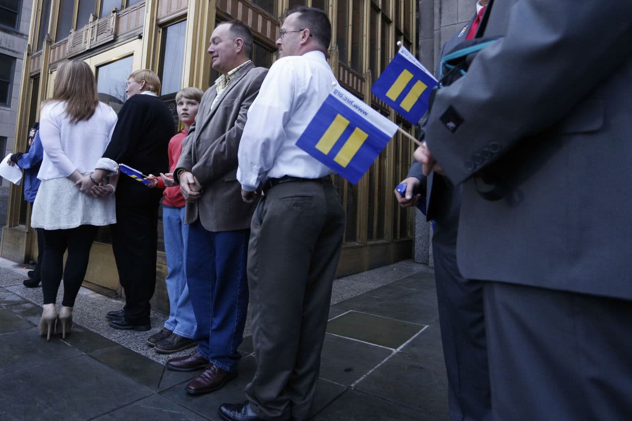 Same-sex couples wait for the Jefferson County courthouse doors to open so they can be legally married, Monday, Feb. 9, 2015, in Birmingham, Ala. A federal judge's order overturning the state's ban on gay marriage goes into effect on Monday, making Alabama the 37th state to allow gays and lesbians to wed. (AP)