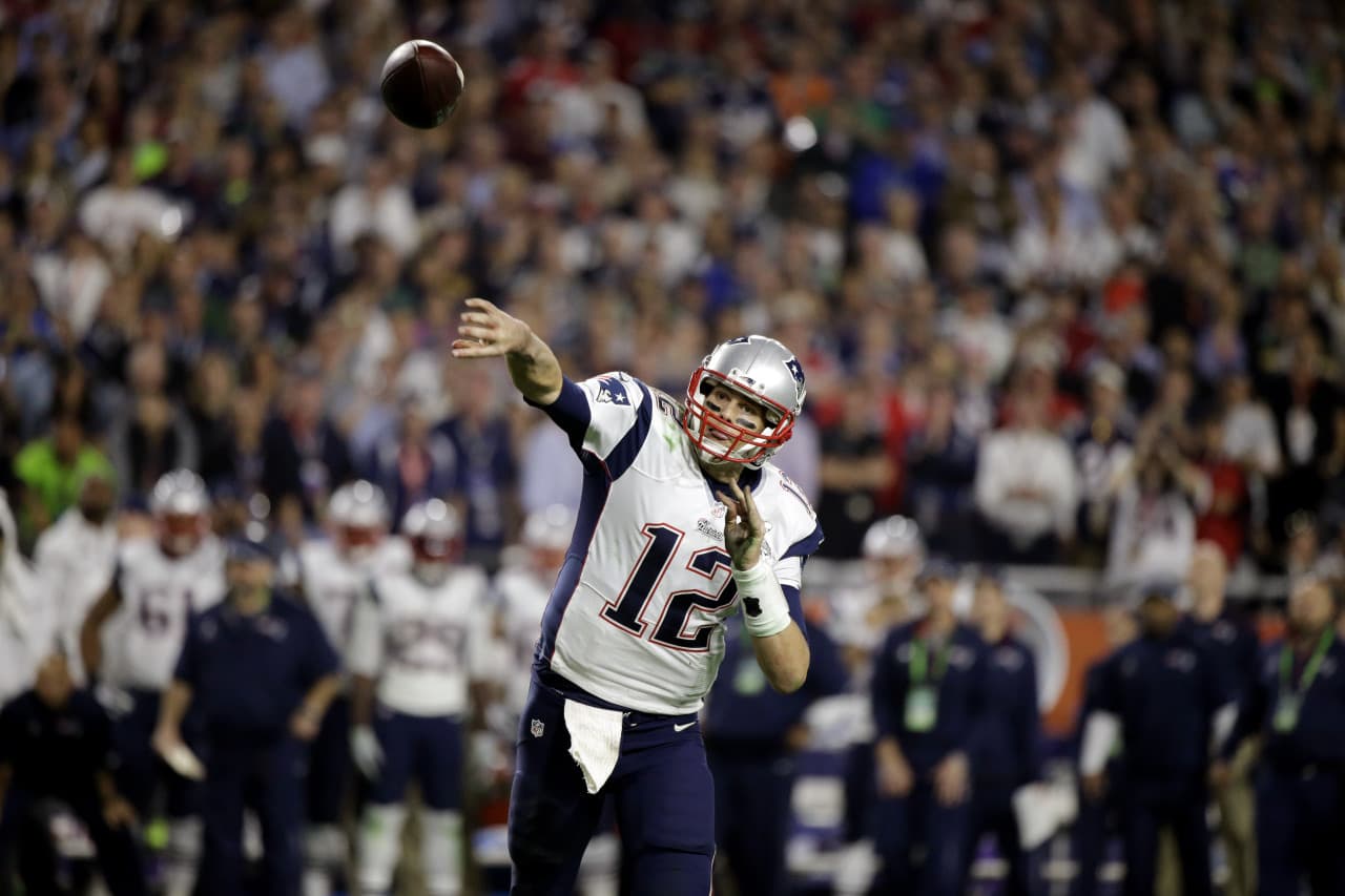 Tom Brady thew two fourth-quarter touchdown passes to put the Patriots ahead 28-14 . (David Goldman/AP)