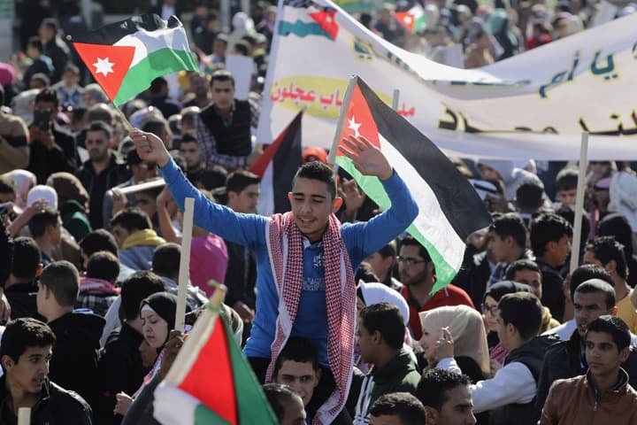 Jordanians chant slogans to show their support for the government against terror during a rally in Amman, Jordan, Thursday, Feb. 5, 2015. Jordanian warplanes bombed Islamic State targets on Thursday, state TV said, after Jordan's King Abdullah II vowed to wage a "harsh" war against the militants who control large areas of neighboring Syria and Iraq. (AP)