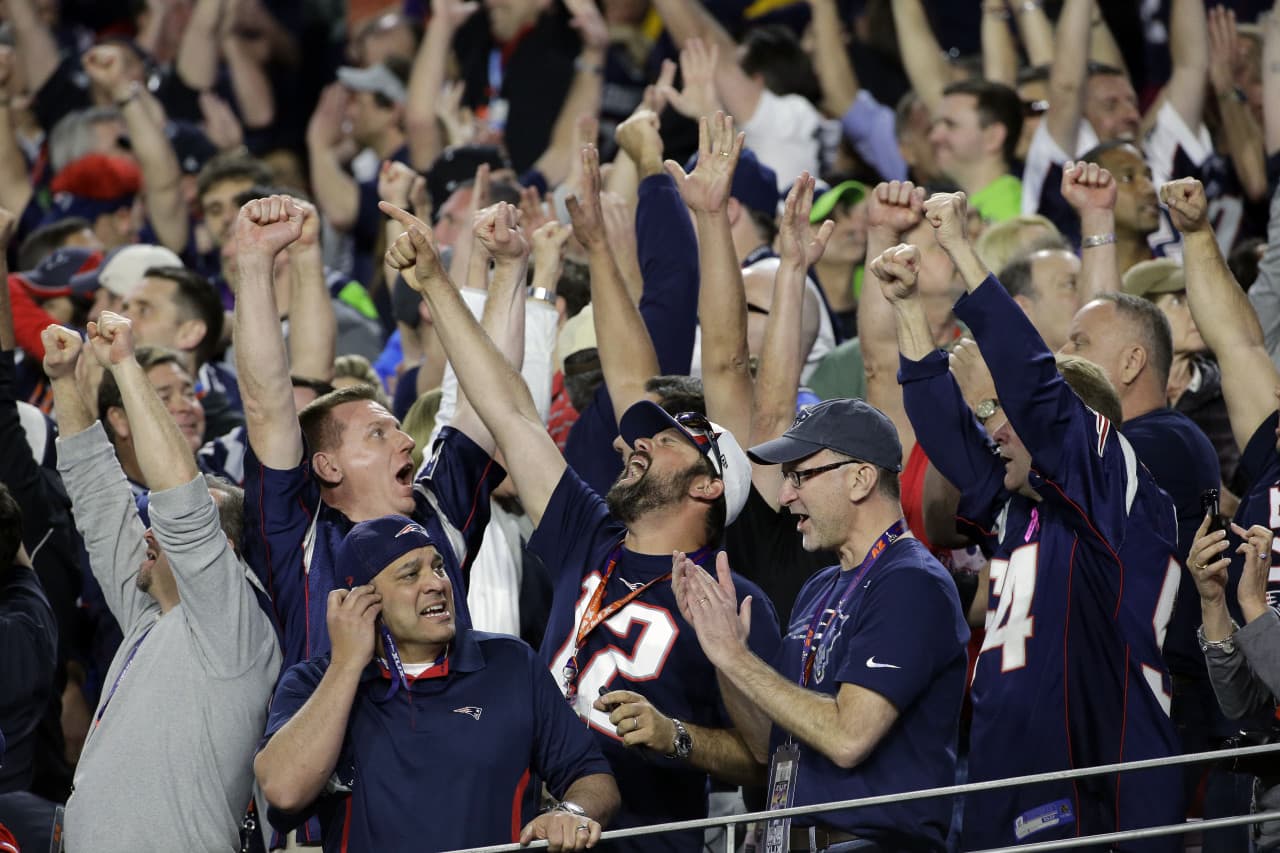 New England Patriots fans cheer after they scored during the second half of NFL Super Bowl XLIX. (Kathy Willens/AP)