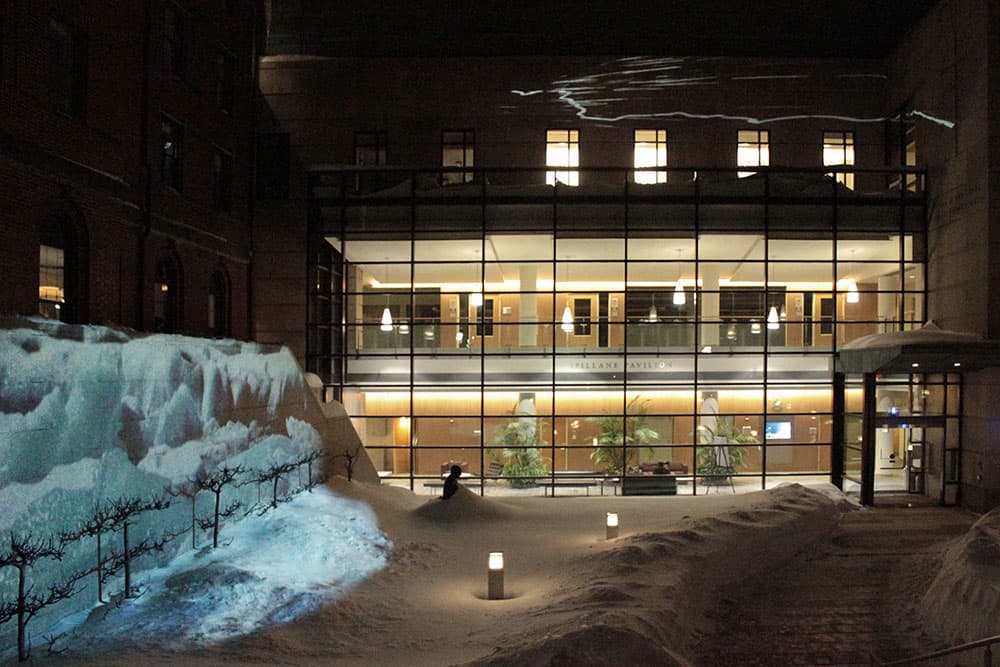 Georgie Friedman's “Under the Icy Sky” projections on the College of Holy Cross, including "Shifting Ice" at left and “The Building Storm” at top. (Georgie Friedman)