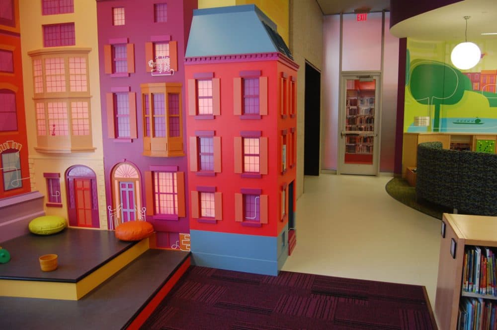The StoryScape story hour area is modeled after a Boston neighborhood with brownstones,” Colford says. These building facades in the Children’s Library were created by Mystic Scenic Studios of Norwood. (Greg Cook)