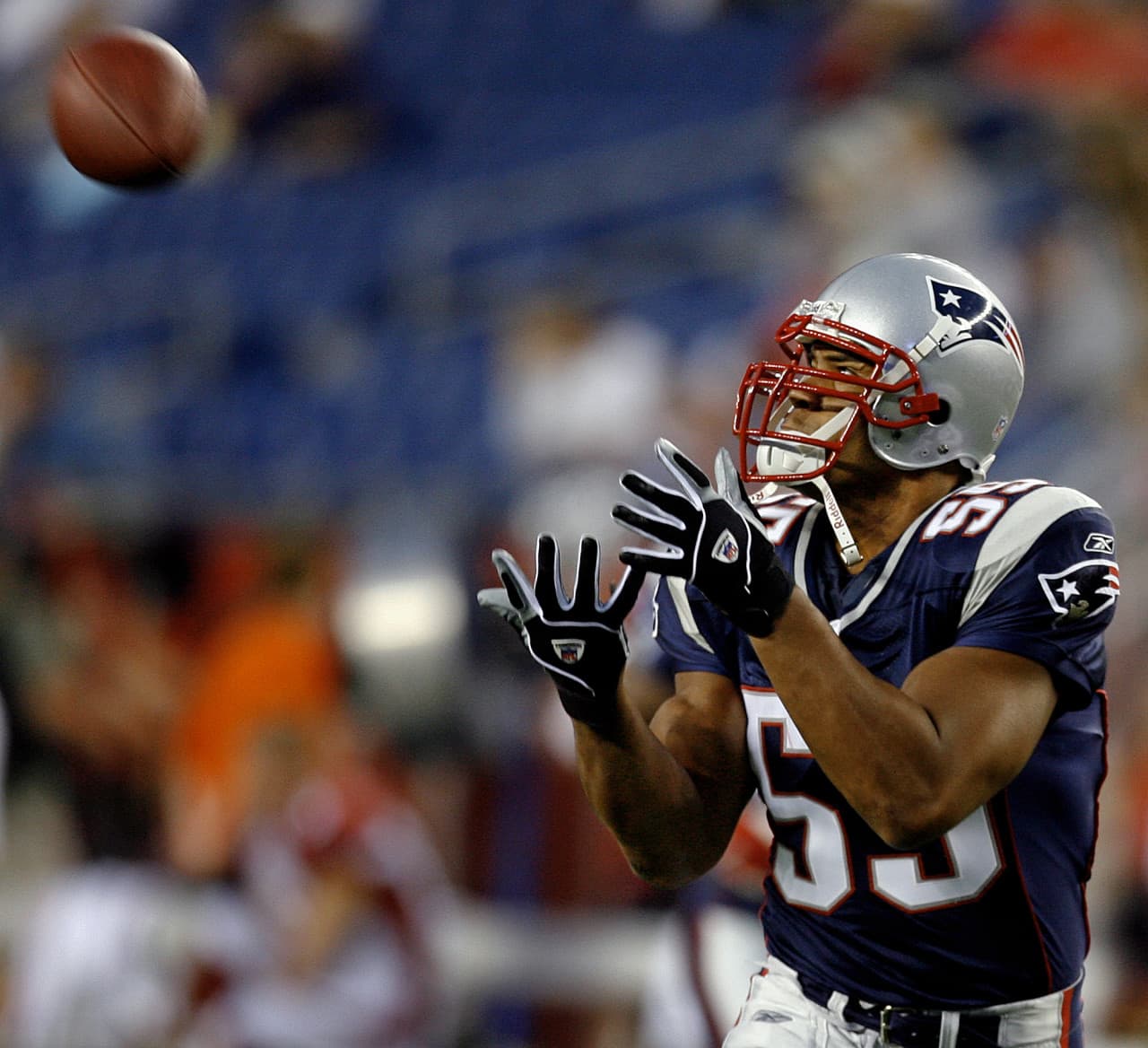 Former Patriots' linebacker, Junior Seau, warms up before a preseason NFL football game in Foxborough, Mass. in 2006. (Stephan Savoia/AP)