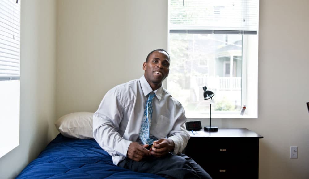 Mark Mack, 36, had been homeless, on and off, for 26 years. Here he is in his new apartment in Dorchester -- the first lease he'd ever signed. (Courtesy of Laura Hajar via Pine Street Inn)