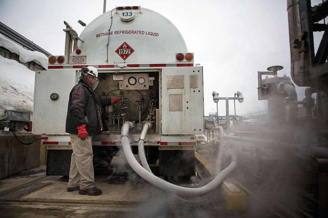 Jerome Bowen fills a truck with liquefied natural gas. Everett Distrigas filled over 10,000 trucks in 2014. (Jesse Costa/WBUR)