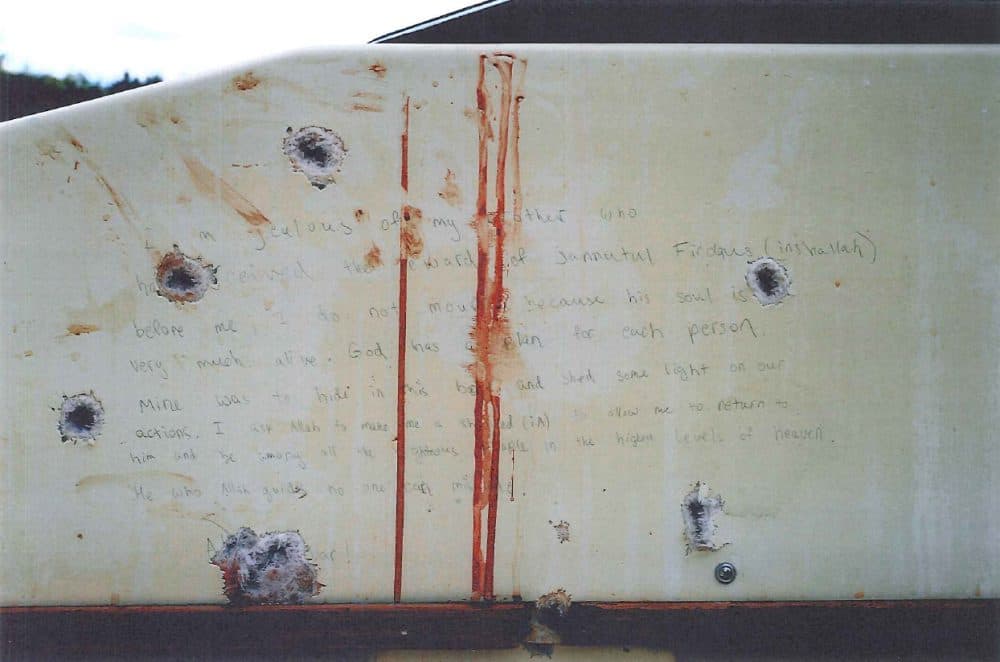 A photo of part of the handwritten note found inside the boat where Dzhokhar Tsarnaev was found hiding in Watertown. (Department of Justice)