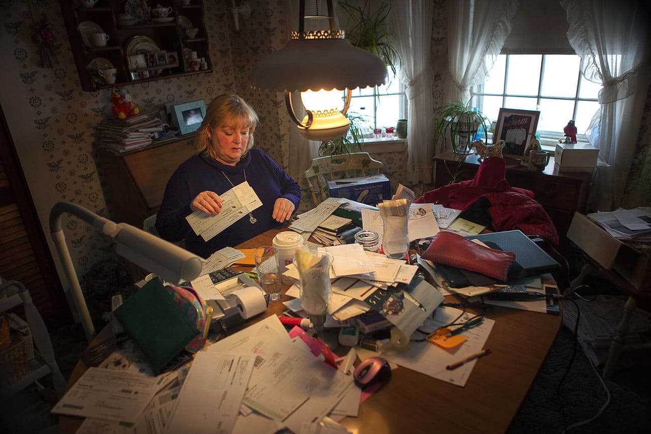 Sharon Blood, who still works on the farm but is no longer married to Dick Blood, remembers the time after the fire vividly. “Groton is kind of a ritzy little town, you know? To have them say, ‘Bring your slaughterhouse back,’ was really something. We must be doing something right!” Here she processes payroll at the main house on the farm. (Jesse Costa/WBUR)