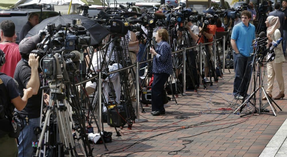 Television cameras sitting on tripods are lined up outside the federal courthouse prior to the arraignment of Dzhokhar Tsarnaev, Wednesday, July 10, 2013, in Boston. (Steven Senne/AP)