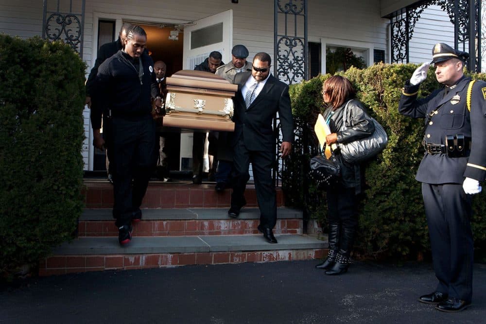 The casket of Gail Miles is carried out of her funeral service at Davis Funeral Home in Boston's Roxbury neighborhood on Dec. 12, 2011. Watertown police sent an honor guard to the Mass. (Courtesy of Kayana Szymczak)