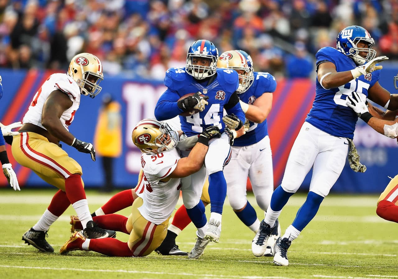 Giants running back Andre Williams (44) says he was surprised to learn 49ers linebacker Chris Borland (50) is retiring after just one NFL season. (Al Bello/Getty Images)