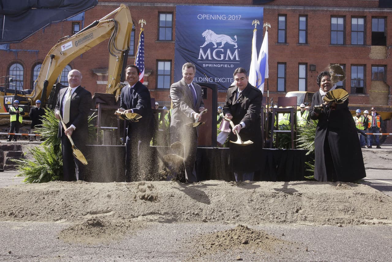 From left: Massachusetts Gaming Commission Chair Stephen Crosby; Michael Mathis, president and COO of the MGM Springfield Casino Resort; James Murren, chairman and CEO of MGM Resorts International; Springfield Mayor Domenic Sarno; and Ethel Griffin, a member of HAP Housing's board of directors, on Tuesday take part in a photo-op during a ground breaking ceremony for the $800 million MGM casino resort scheduled to open in 2017 in Springfield. (Stephan Savoia/AP)
