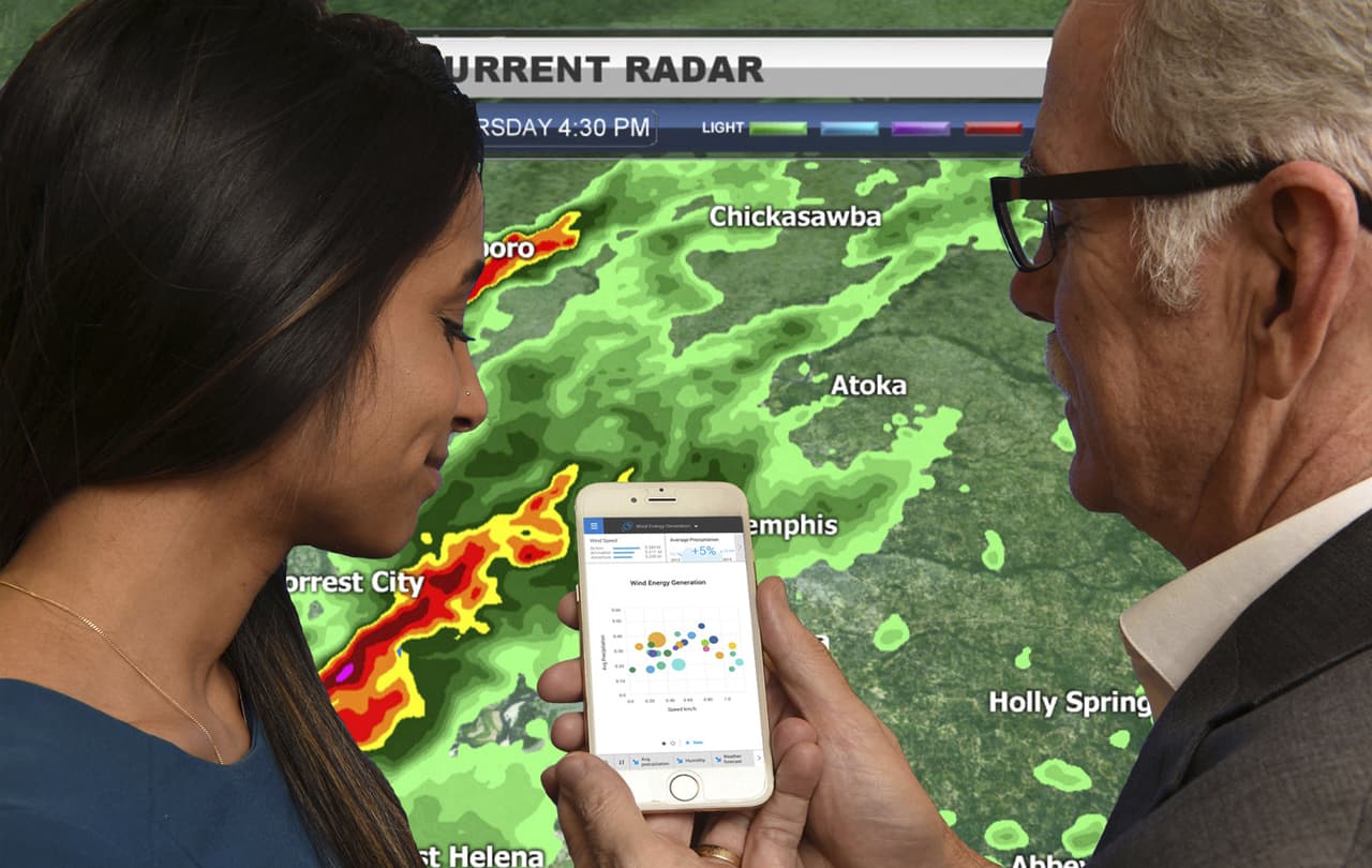 Manju Malkani, IBM analytics consultant, left, and Paul Walsh, Vice President of Weather Analytics at The Weather Company, access real-time weather data through IBM Watson Analytics, in NYC on Tuesday, March 31, 2015. (Jon Simon/IBM)