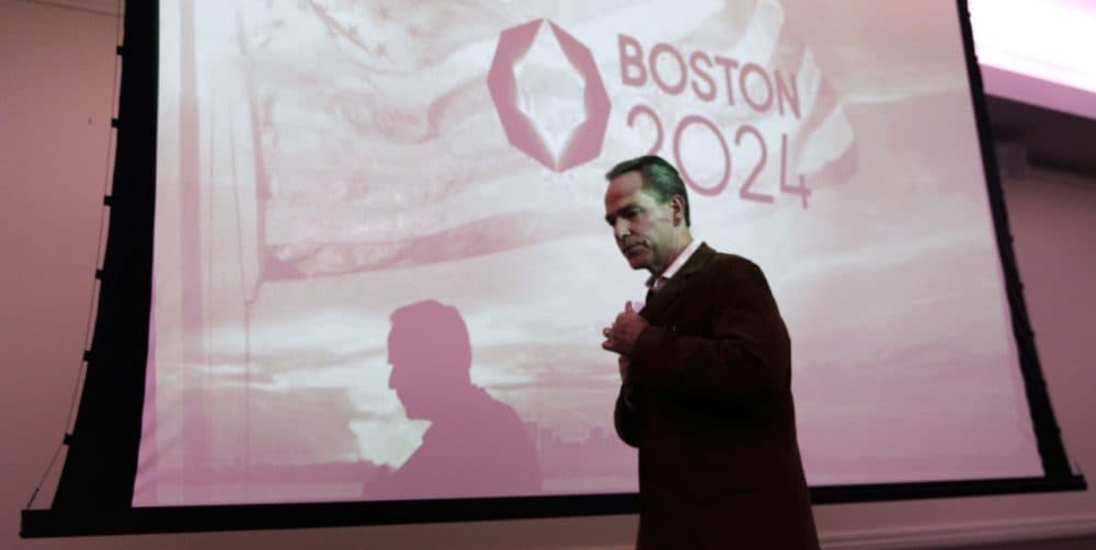 John Fish, chair of Boston 2024, heads back to his seat after addressing a public forum last month about Boston's 2024 Olympics bid. (Charles Krupa/AP)