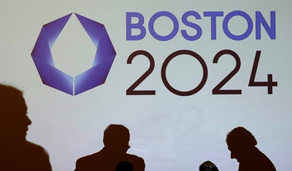The Boston 2024 logo is displayed on a screen before a January news conference about the bid. (Charles Krupa/AP)