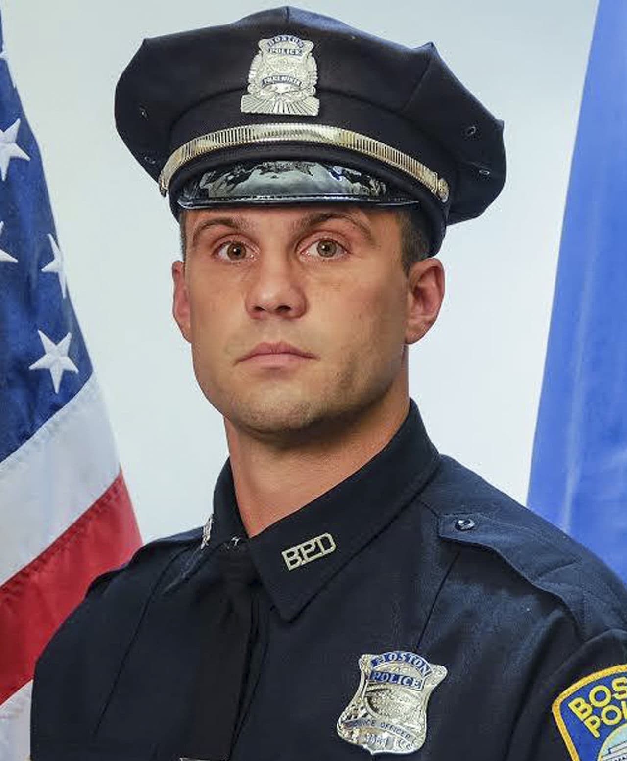 Officer John Moynihan, 34, was shot in the face during a traffic stop Friday night that ended when other officers fatally shot his attacker. (Boston Police Department)