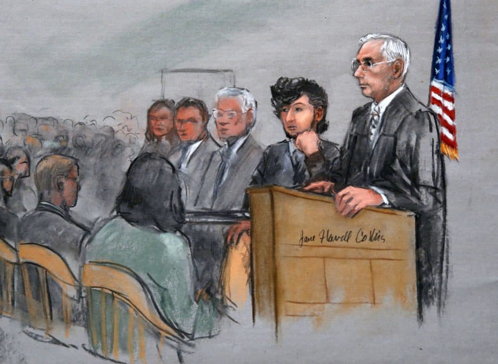 In this courtroom sketch, Boston Marathon bombing suspect Dzhokhar Tsarnaev, second from right, is depicted with his lawyers, left, beside U.S. District Judge George O'Toole Jr., right, as O'Toole addressed a pool of potential jurors in early January. (Jane Flavell Collins/AP)