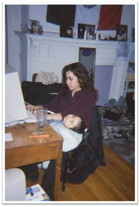 The author's daughter sleeps while her mother completes homework in her dorm room at MIT during her Freshman year. (Noramay Cadena/Courtesy)