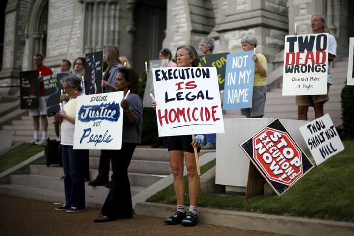 In this file photo, a group of death penalty opponents hold a vigil outside St. Francis Xavier College Church hours before the scheduled execution of Missouri death row inmate Russell Bucklew Tuesday, May 20, 2014, in St. Louis. (AP)