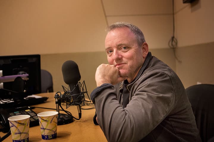 Novelist Dennis Lehane sits in the On Point Studio on Friday, March 13, 2015. (Jesse Costa / WBUR)
