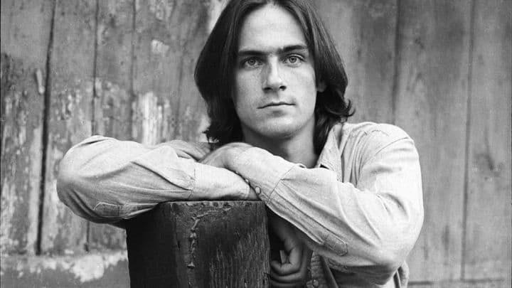 James Taylor, 1969. This iconic photo of James Taylor was the album cover for "Sweet Baby James." The photo shoot took place at Cyrus Faryar's farm, which Diltz describes as a creative commune that was out in the hills in L.A. Diltz was told by Taylor’s manager to just take black and whites, but Diltz liked the image of Taylor’s blue work shirt against the barn, so he snapped the some color photos. The color photo ended up being chosen for the album cover. (Henry Diltz)