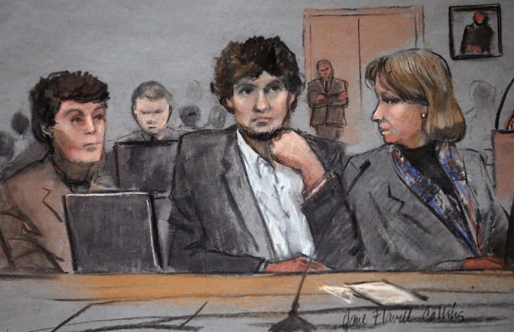 In this courtroom sketch, Dzhokhar Tsarnaev, center, is depicted between defense attorneys Miriam Conrad, left, and Judy Clarke, right, during his federal death penalty trial. (Jane Flavell Collins/AP)