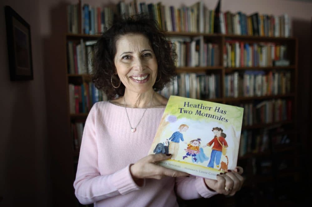 Author Leslea Newman, of Holyoke, Mass., displays a copy of her book "Heather Has Two Mommies." (Steven Senne/AP)