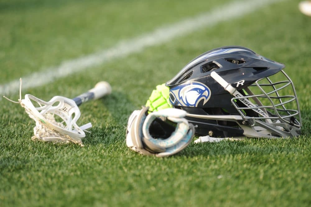 Male lacrosse players are required to wear helmets. Florida became the first state to require female lacrosse athletes to do the same. (Mitchell Layton/Getty Images)
