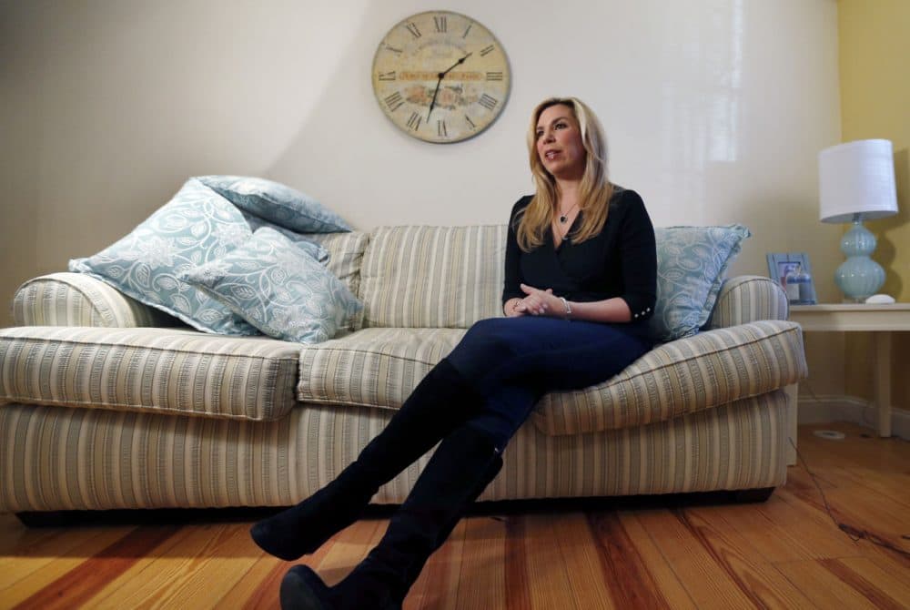 Boston Marathon bombing survivor Heather Abbott speaks during an interview at her home in Newport, R.I., in December 2014. For Abbott, who lost her left leg, One Fund Boston helped cover the costly prosthetics that allowed her to reclaim some degree of normalcy. (Elise Amendola/AP)