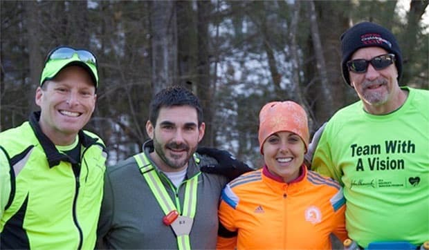 Marathon team, from left: Running coach Greg Hallerman, first-half guide Peter Houde, second-half guide Christine Houde and Randy Pierce. (Courtesy 2020visionquest.org)