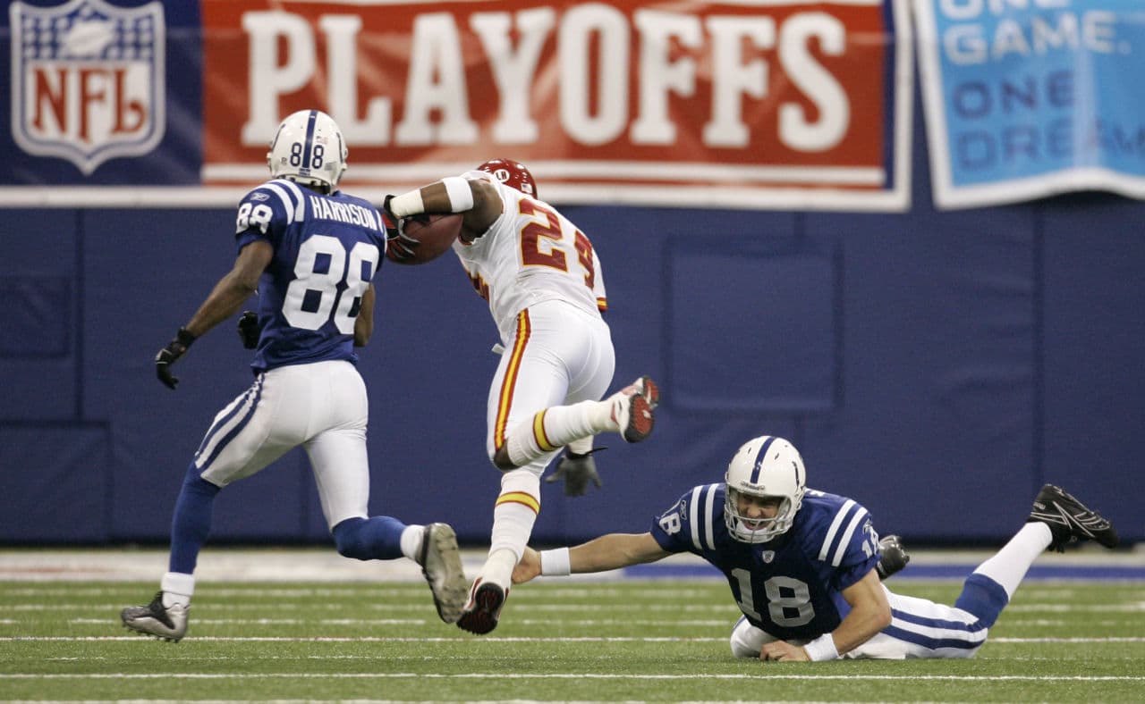 Former Colts quarterback Peyton Manning is not in the NFL for his tackling ability. Similarly MLB pitchers aren't paid to hit. Yet in the NL, they have to do it nearly every start. (Darron Cummings/AP)