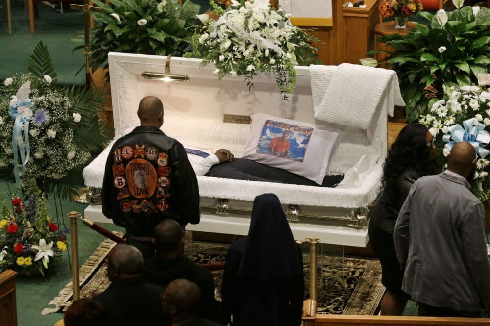 Mourners view the body of Freddie Gray before his funeral at New Shiloh Baptist Church, Monday, in Baltimore. Gray died from spinal injuries about a week after he was arrested and transported in a Baltimore Police Department van. (Patrick Semansky/AP)