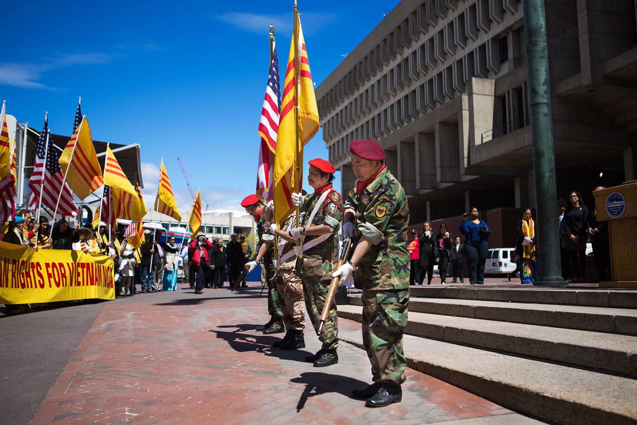 – Former soldiers of the South Vietnamese Army pose for a moment of silence honoring all of the people killed during the Vietnam War.  (Jesse Costa/WBUR)