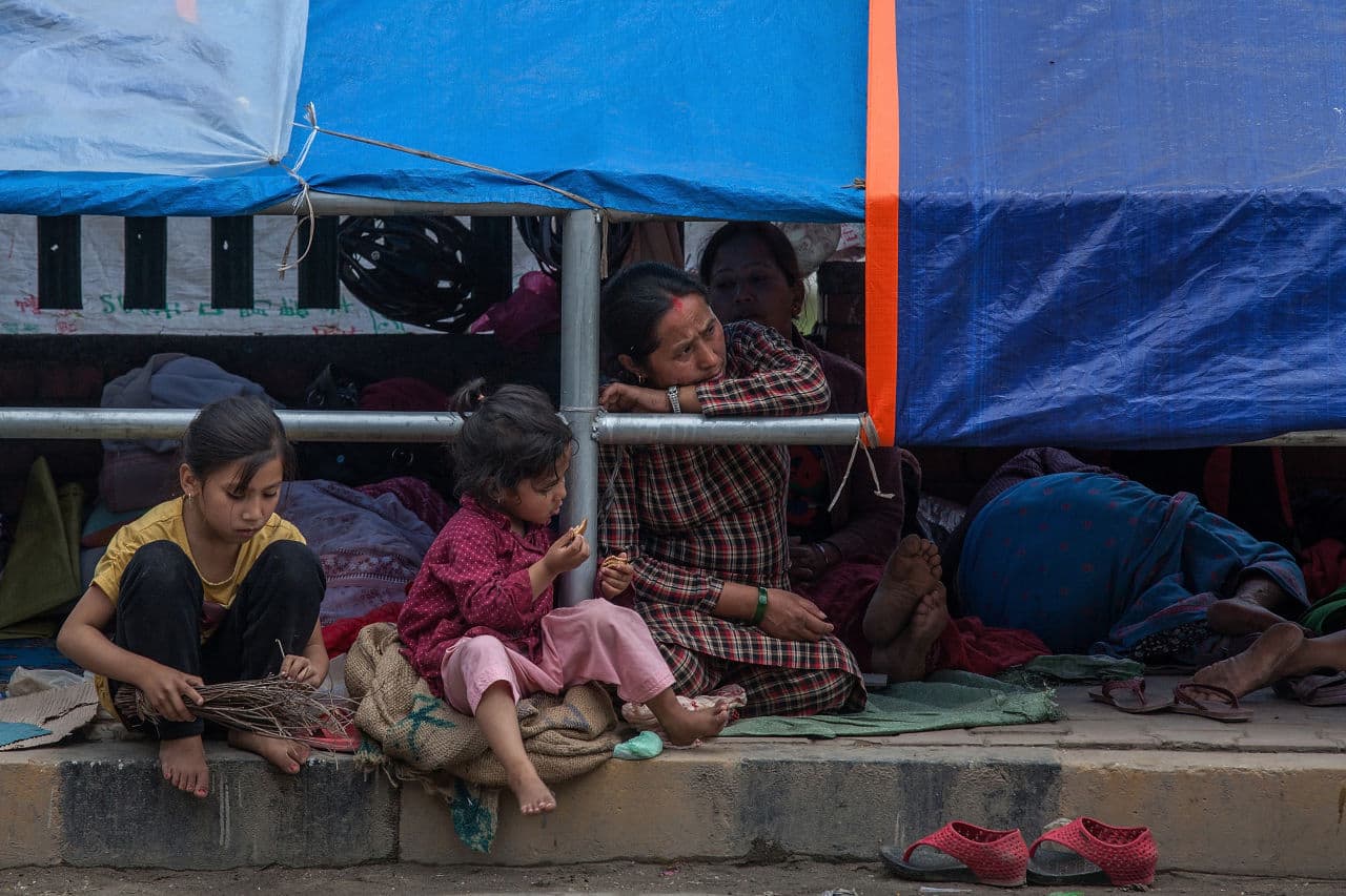 A major 7.8 earthquake hit Kathmandu mid-day on Saturday, and was followed by multiple aftershocks that triggered avalanches on Mt. Everest that buried mountain climbers in their base camps. Many houses, buildings and temples in the capital were destroyed during the earthquake, leaving over 2 thousand dead and many more trapped under the debris as emergency rescue workers attempt to clear debris and find survivors. (Omar Havana/Getty Images)