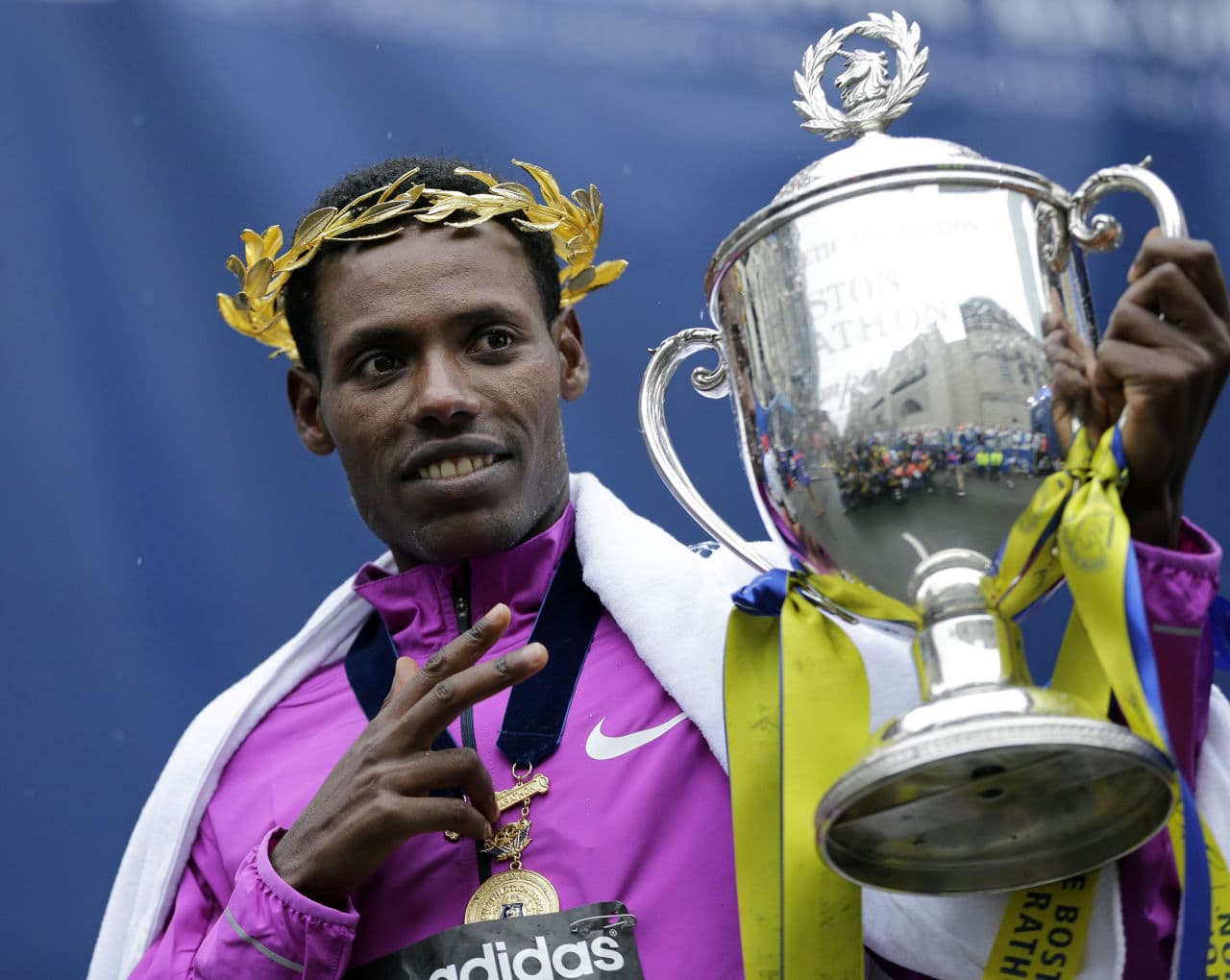 Lelisa Desisa holds his trophy after winning the 119th Boston Marathon. (Elise Amendola/AP)