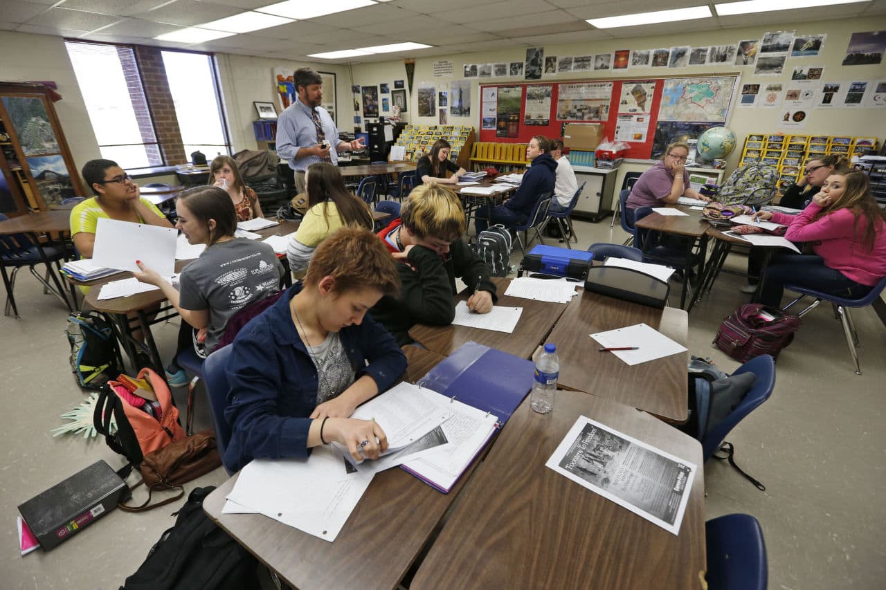 Joe Servis, top, an advanced placement U.S. history teacher at Appomattox High School lectures his students at the school in Appomattox, Va., Wednesday, April 1, 2015. Servis had his students write essays drawing on their own experiences, black and white, with race. (Steve Helber/AP)