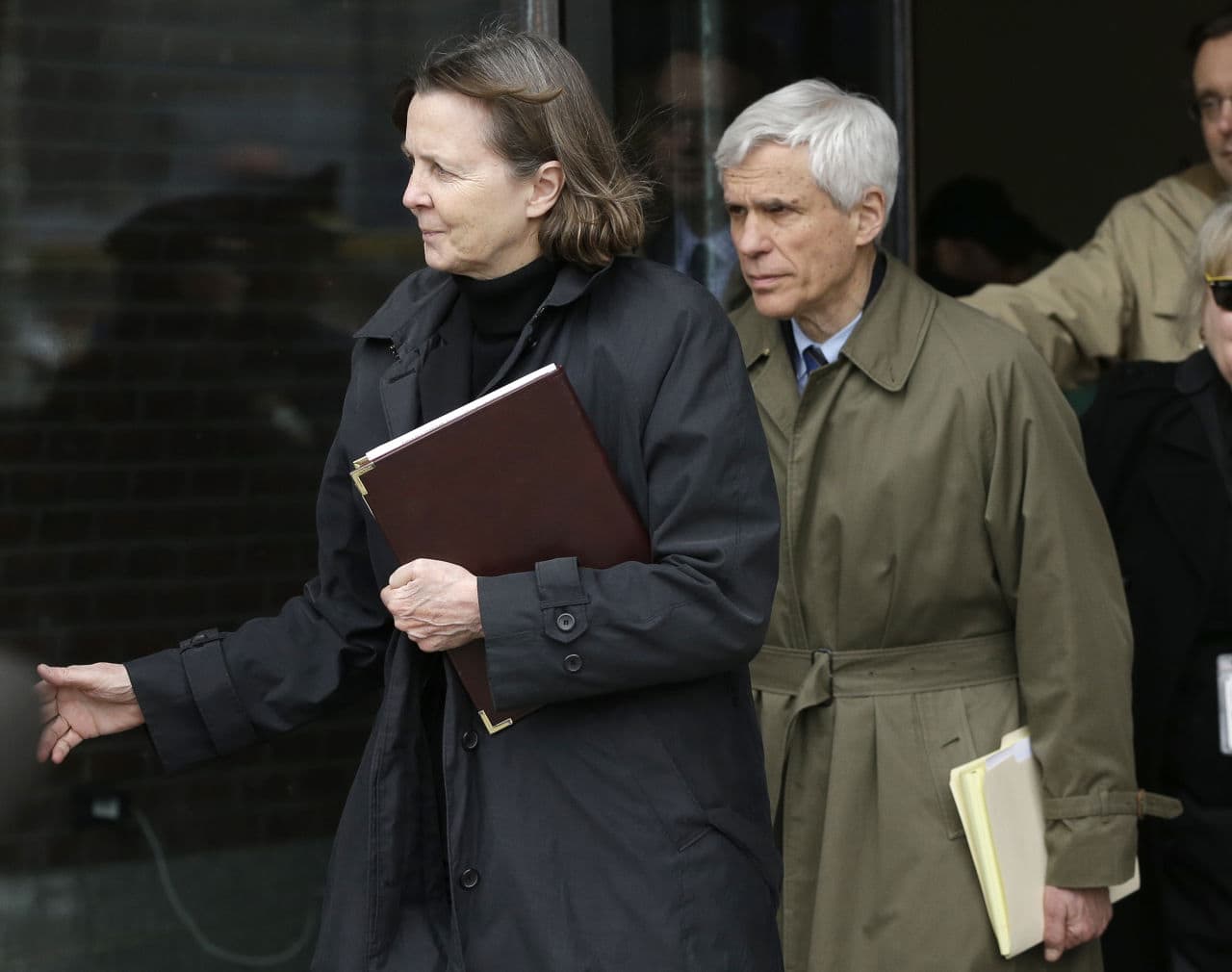 Defense attorneys Judy Clarke, left, and David Bruck leave federal court Wednesday following the verdict.  (Steven Senne/AP)