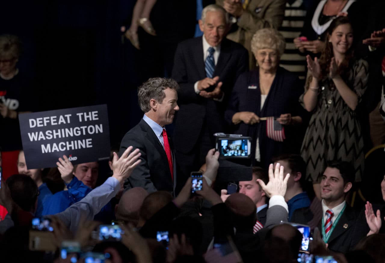 Sen. Rand Paul, R-Ky. kicks off his presidential campaign at the Galt House Hotel in Louisville, Ky., Tuesday, April 7, 2015. In the background, upper right, are his parents, former Texas Rep. Ron Paul and his wife Carol. (Carolyn Kaster/AP)