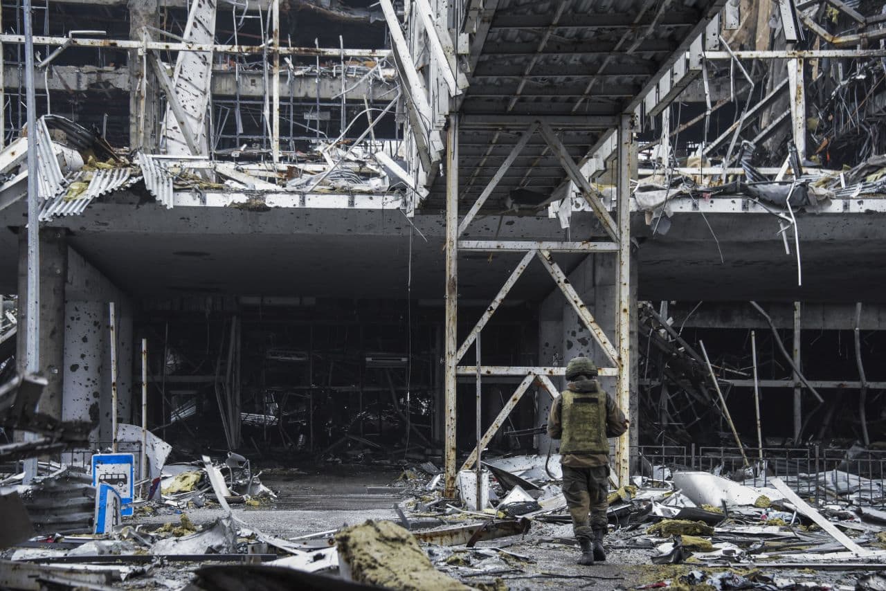 A Russia-backed rebel enters the destroyed building of Donetsk Airport just outside Donetsk, eastern Ukraine, Thursday, April 2, 2015. OSCE monitors accompanied by pro-Russian rebels visited the ruins of Donetsk Airport and nearby areas to monitor the situation on the ground and discuss the observance of Februarys cease-fire. (Mstyslav Chernov/AP)