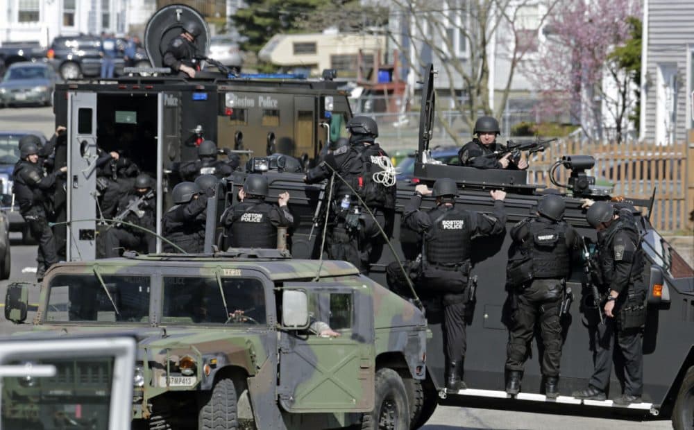 Tactical teams drive through Watertown while searching for Dzhokhar Tsarnaev following the Boston Marathon bombings. (AP)