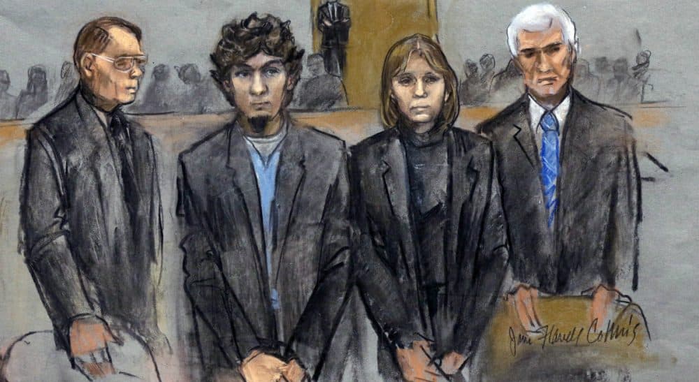 In this courtroom sketch, Dzhokhar Tsarnaev, second from left, is depicted standing with his defense attorneys William Fick, left, Judy Clarke, second from right, and David Bruck, right, as the jury presents its verdict in his federal death penalty trial Wednesday, April 8, 2015, in Boston. Tsarnaev was convicted on multiple charges in the 2013 Boston Marathon bombing. Three people were killed and more than 260 were injured when twin pressure-cooker bombs exploded near the finish line. (Jane Flavell Collins/AP)