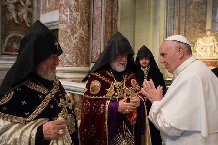 In this Sunday, April 12, 2015 pool photo Pope Francis, right, is greeted by Catholicos Aram I, second left, and the head of Armenia's Orthodox Church Karekin II, left, during an Armenian-Rite Mass in St. Peter's Basilica, at the Vatican. Pope Francis on Sunday marked the 100th anniversary of the slaughter of Armenians by calling the massacre by Ottoman Turks "the first genocide of the 20th century" and urging the international community to recognize it as such. (AP)