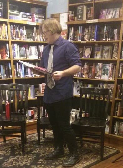 The writer in his element—giving a bookstore reading. (Photo courtesy of Porter Square Books.)