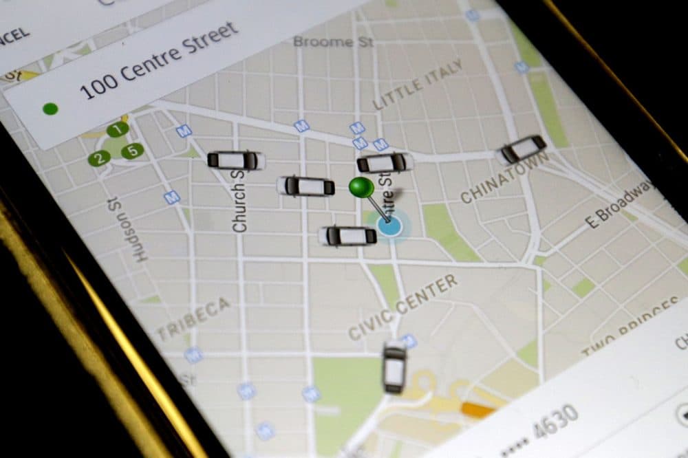 The Uber app displays cars available to make a pickup in downtown Manhattan on a smart phone. (Mary Altaffer/AP)