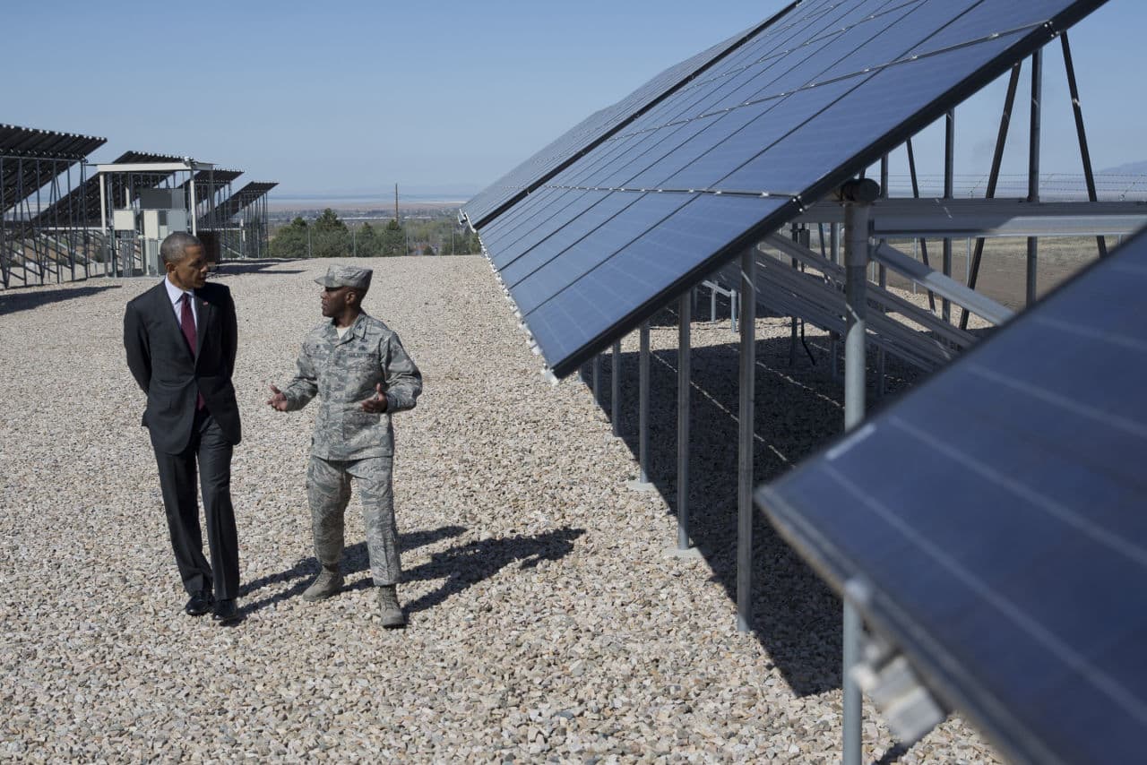 President Barack Obama tours a solar array with Col. Ronald E. Jolly at Hill Air Force Base, Friday, April 3, 2015, in Hill Air Force Base, Utah, before speaking about clean energy and jobs numbers. (AP)