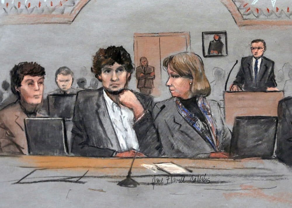 In this March 5, 2015 file courtroom sketch, Dzhokhar Tsarnaev, center, is depicted between defense attorneys Miriam Conrad, left, and Judy Clarke, right, during his federal death penalty trial in Boston. (Jane Flavell Collins/AP)