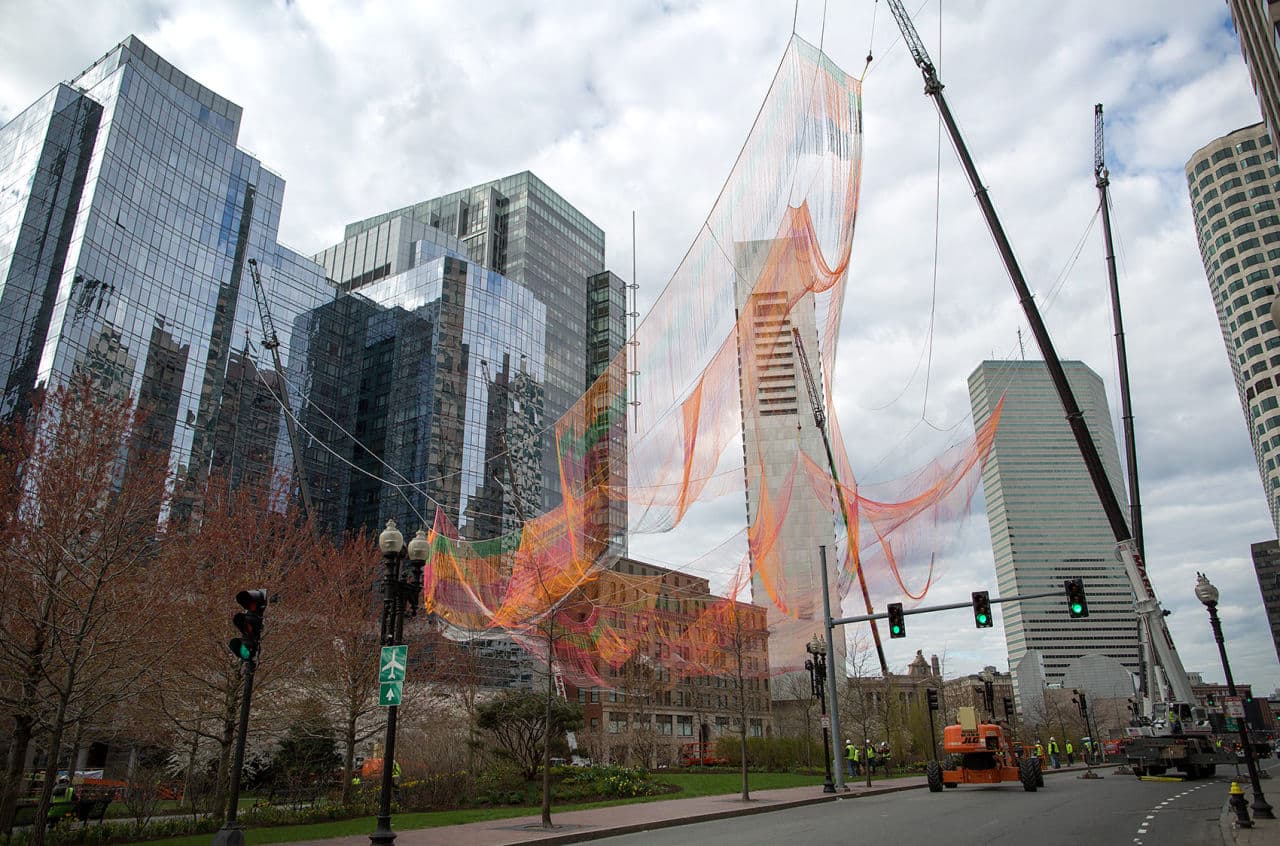 Roads around the Greenway were closed Sunday so six cranes could work to attach the sculpture to three high-rise buildings. (Robin Lubbock/WBUR)